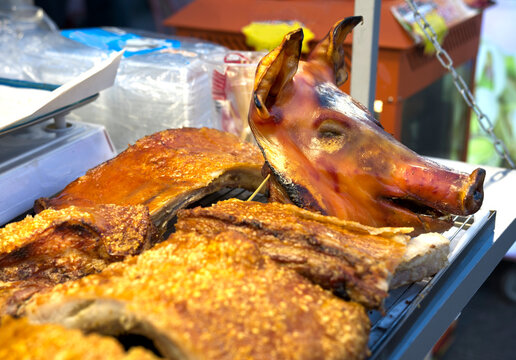 Roasted crispy pig head and crackling ,at a night market in Vien