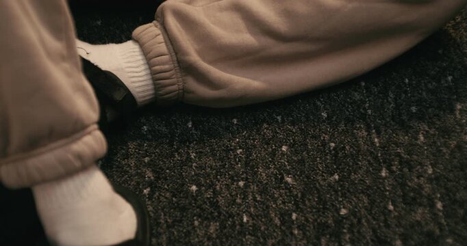 Cinematic shot of person taking letter out of view, then dropping letter and smartphone into frame