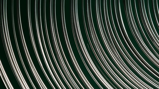 Abstract background with a dark green color. it has a diagonal pattern of thin white lines that create a wave-like effect. the lines are arranged in a way that creates a sense of depth and dimension.
