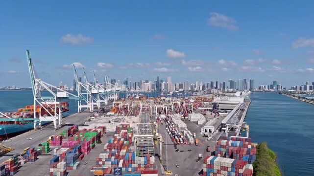 Miami, Florida, USA - May 21, 2025: Freight container cargo. Port of Miami. Container port loading. Export and import. Cargo business. Cargo services with container in Miami port terminal