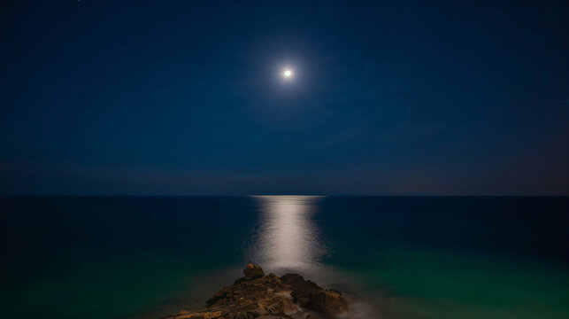 Atmospheric Mediterranean night coast with diffused moonlight