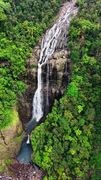 Cinematic aerial drone footage of Shangliar Falls, a stunning multi-tiered cascading waterfall located in Meghalaya, Northeast India, near the Sylhet border of Bangladesh.