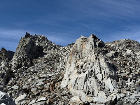 Rugged rock formations and giant granite boulders along a high-altitude hiking route in the Swiss Alps near Realp in the canton of Uri, showing steep cliffs, alpine terrain and dramatic mountain