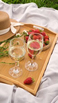 Picnic with strawberries and wine. Selective focus.