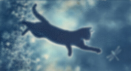 Fototapeta premium Silhouette of cat jumping through sky with dragonfly shows artistic dreamlike nature scene for background.