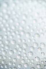 Close up of Black and White Abstract Water Drops on Glass Background © Anna Hoychuk
