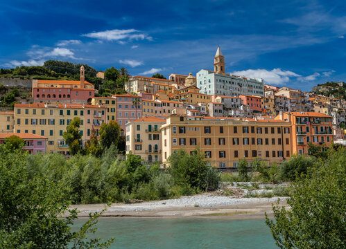 Colorful Mediterranean houses across Roya river in old town Ventimiglia, Italy