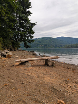 wooden bench at lake beach