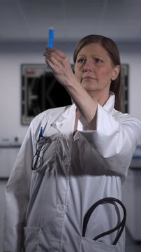 Reseracher holding test tube