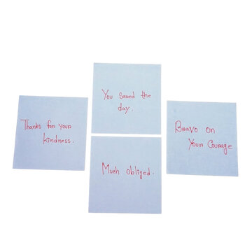 Four white square paper notes with handwritten messages isolated on a transparent background