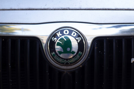 Belgrade, Serbia - September 17, 2026: Skoda car logo and winged arrow emblem on chrome grille frame of modern vehicle, close up automotive brand badge on transport front hood. Retail, shop, store