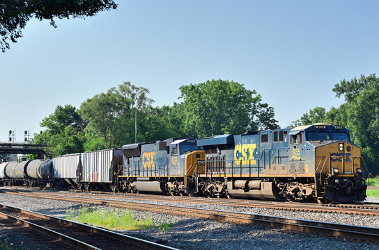 CSX Transportation locomotives lead an ethanol train through a busy rail juntion in south suburban Chicago. 