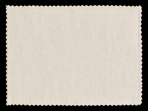 Cream woven fabric swatch with scalloped edges on black background