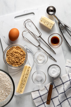 Ingredients and tools on a cutting board for making Pecan Pie Cookies.