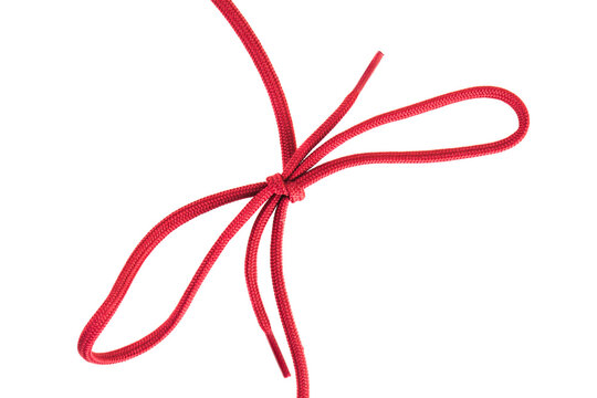 red shoe laces with a knot against white background
