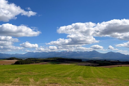 Patchwork farmland and mountains in Biei, Hokkaido, Japan