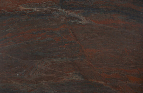 Dark red granite stone surface with natural mineral texture background polished material interiors construction architecture backdrop flooring cladding countertop detailed finishing