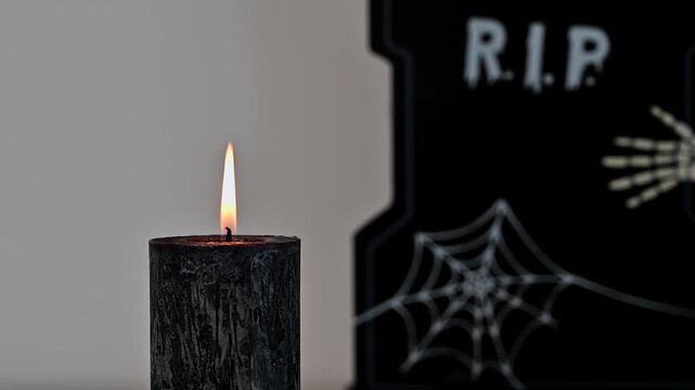 Copy space spooky halloween footage with black candle 