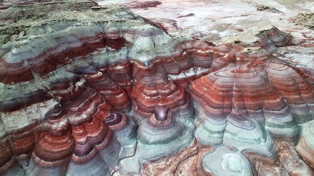 Drone footage of the Bentonite Hills near Hanksville, Utah. Dramatic and colorful abstract background video, landmark, travel destination