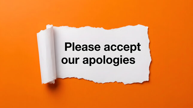 Please accept our apologies text on a torn white paper over orange background