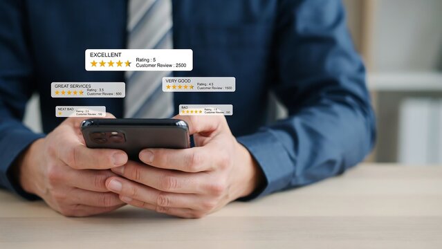 Businessman's hands holding smartphone with excellent customer reviews and star ratings floating above