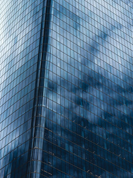 Blue sky and clouds reflected in skyscraper windows