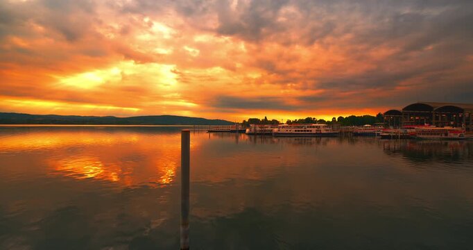 Spectacular sunrise at the port of Arona in Italy