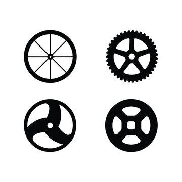 Set of four distinct circular mechanical gears and wheel silhouettes for industrial engineering and automotive transmission system applications