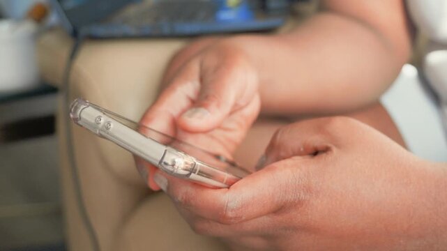 Close Up of Black Woman Hands Holding Smartphone and Scrolling