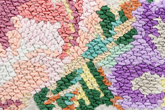 Multicolor abstract needlepoint embroidery texture background