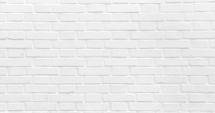Clean white brick wall texture with uniform pattern for commercial design projects