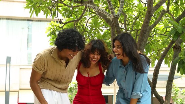 Young Indian Gen Z friends laughing and having fun time together outdoors, smiling and celebrating friendship, social connection, Concept of youth culture, modern india lifestyle