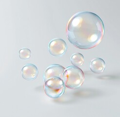 Fototapeta premium Iridescent soap bubbles floating on white background