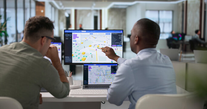 Network Engineer And Technician Review Fiber Optic Route Mapping