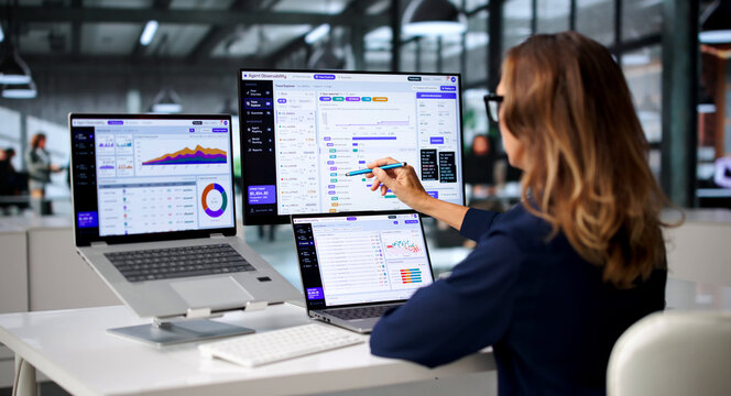 Software Engineer Closely Watches AI Workflow On Laptop