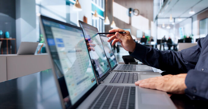 Financial Analyst Studies Cloud Cost Data On Laptop