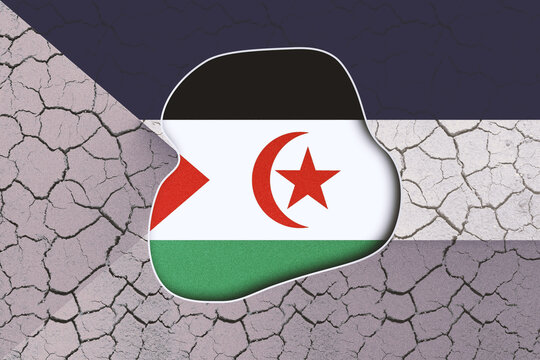 Western Sahara Flag Peeling Back Revealing Cracked Dry Earth Textured Background Symbolizing Environmental Challenges and National Struggles