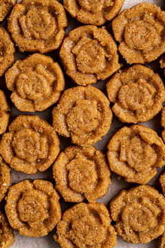 Appetizing traditional kazakh zhent sweet dessert shaped in patterned portions close up