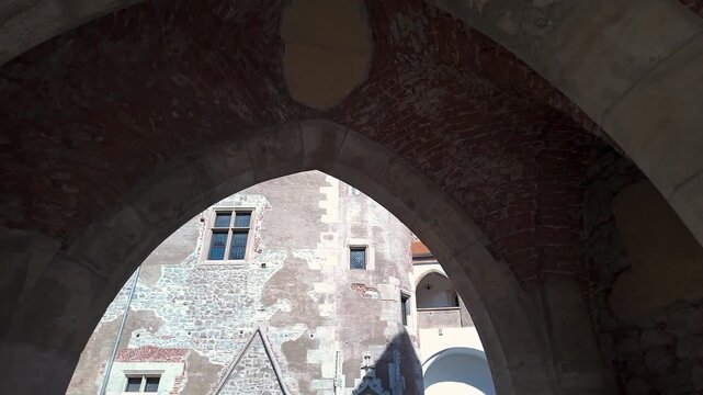 Pointed stone and brick arches viewed from below at Corvin Castle in Hunedoara Romania