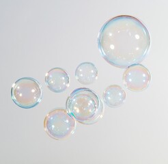Fototapeta premium Colorful iridescent soap bubbles floating on white background