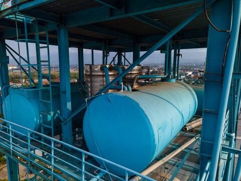 Industrial Water Treatment and Storage Tanks Featuring a Blue Steel Framework, Industrial Infrastructure View from Above.