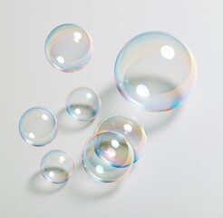 Fototapeta premium Colorful soap bubbles floating on white background