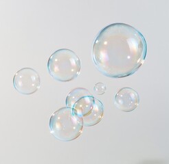 Fototapeta premium Colorful floating soap bubbles against a plain background