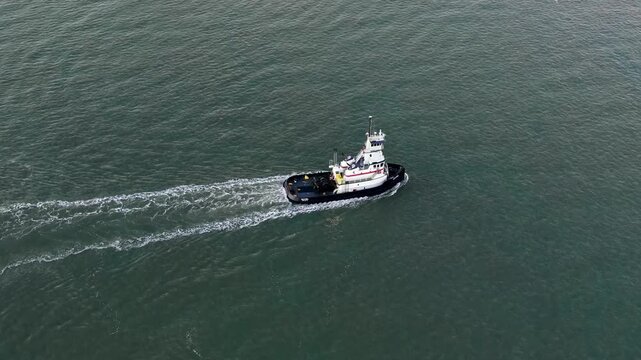 Tugboat Moving Through Open Water