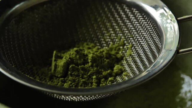 Close-up of matcha powder in a sieve	