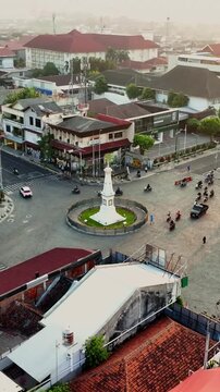 Elevated city view of Tugu Jogja monument at central Yogyakarta intersection