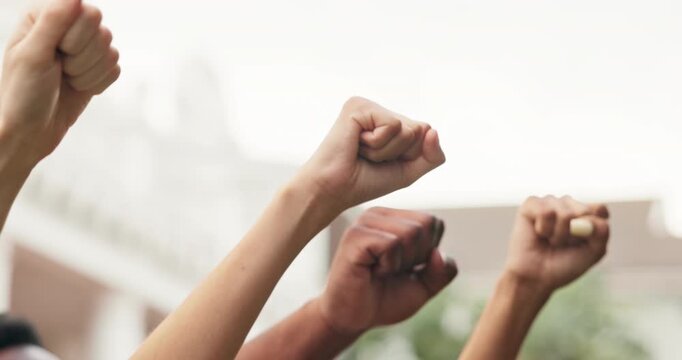 Fist, people and hands raised outdoor for protest, movement and awareness to stop violence. Activist, community and society resistance for humanitarian crisis, honoring victims and genocide justice