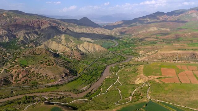 Winding river cuts through lush green valleys (Karasu Erzincan)