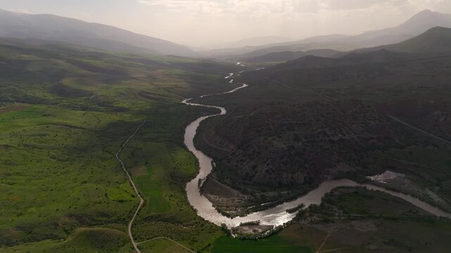 Winding river cuts through lush green valleys (Karasu Erzincan)