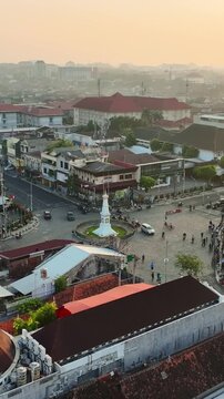 Sunset aerial view overlooking Tugu Jogja and surrounding Yogyakarta cityscape
